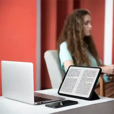 A woman reading an e-book on a tablet, representing the publishing-of-e-books.