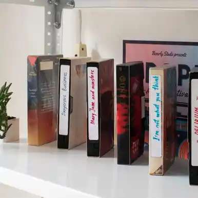 A shelf with a mix of what appear to be physical books and possibly other media, suggesting a hybrid approach.