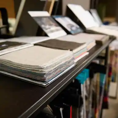 A shelf with stacks of books, representing the physical output of print-on-demand publishing.